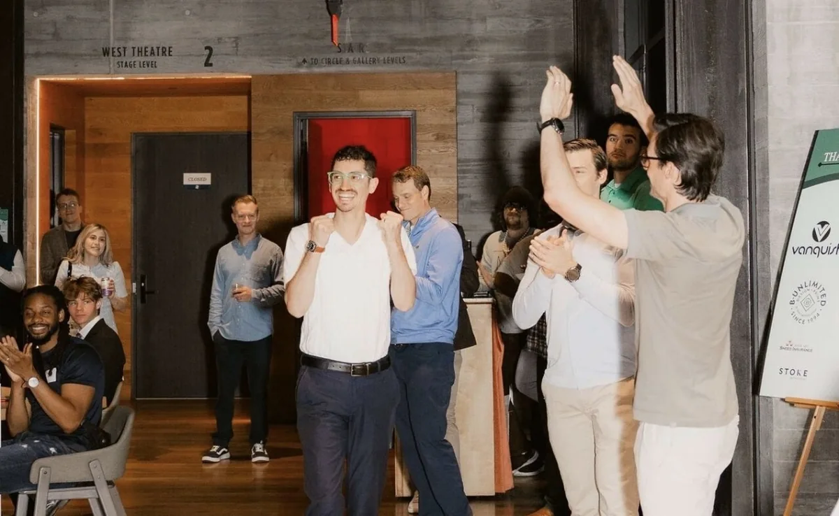 Founders celebrate at a Startup Junkie event at the West Theatre