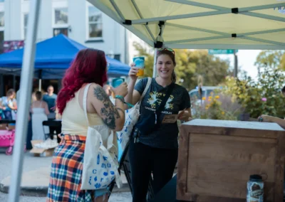 Attendees explore startup booths at Startup Crawl 2026 in downtown Fayetteville