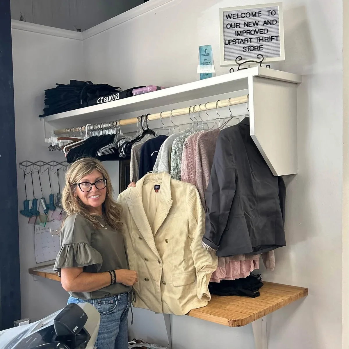 UpStart Thrift volunteer welcomes shoppers to the new and improved store